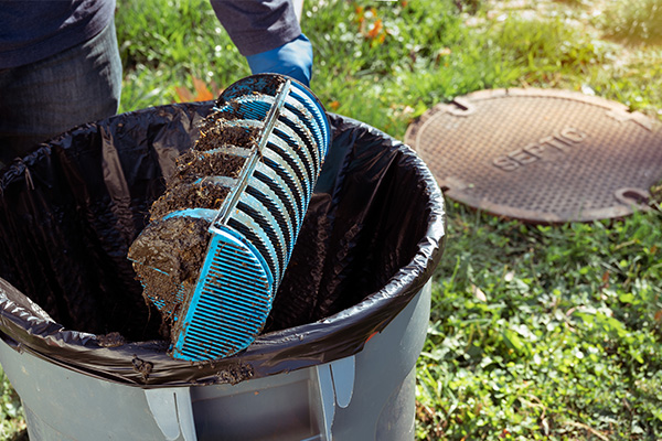 septic specialist holding a Tuf - Tite effluent filter of septic system tank and water wells