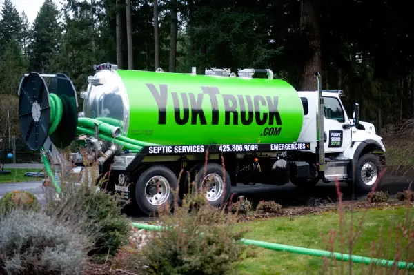 the yuk truck arrives at a seattle wa house for septic system hydro jetting service