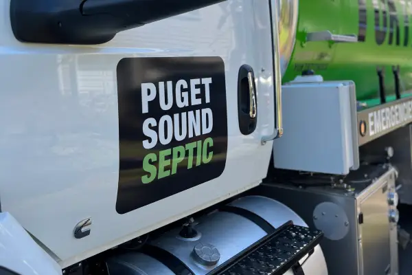 yuk truck door carrying local septic tank experts in seattle area